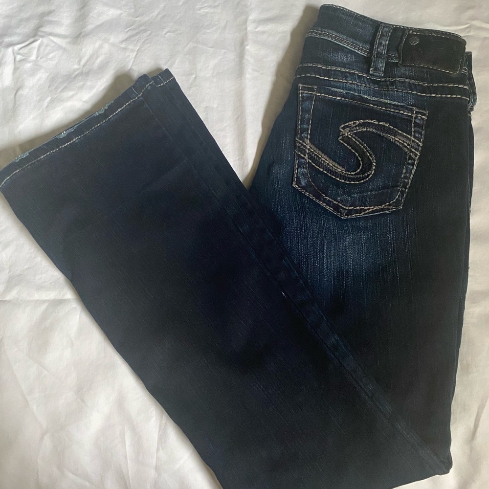 Silver brand Suki dark wash jeans purchased from Buckle.